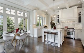 Kitchen in luxury home with white cabinetry.