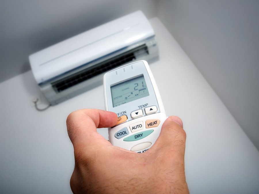 Closeup view about using some appliance such as air condition.